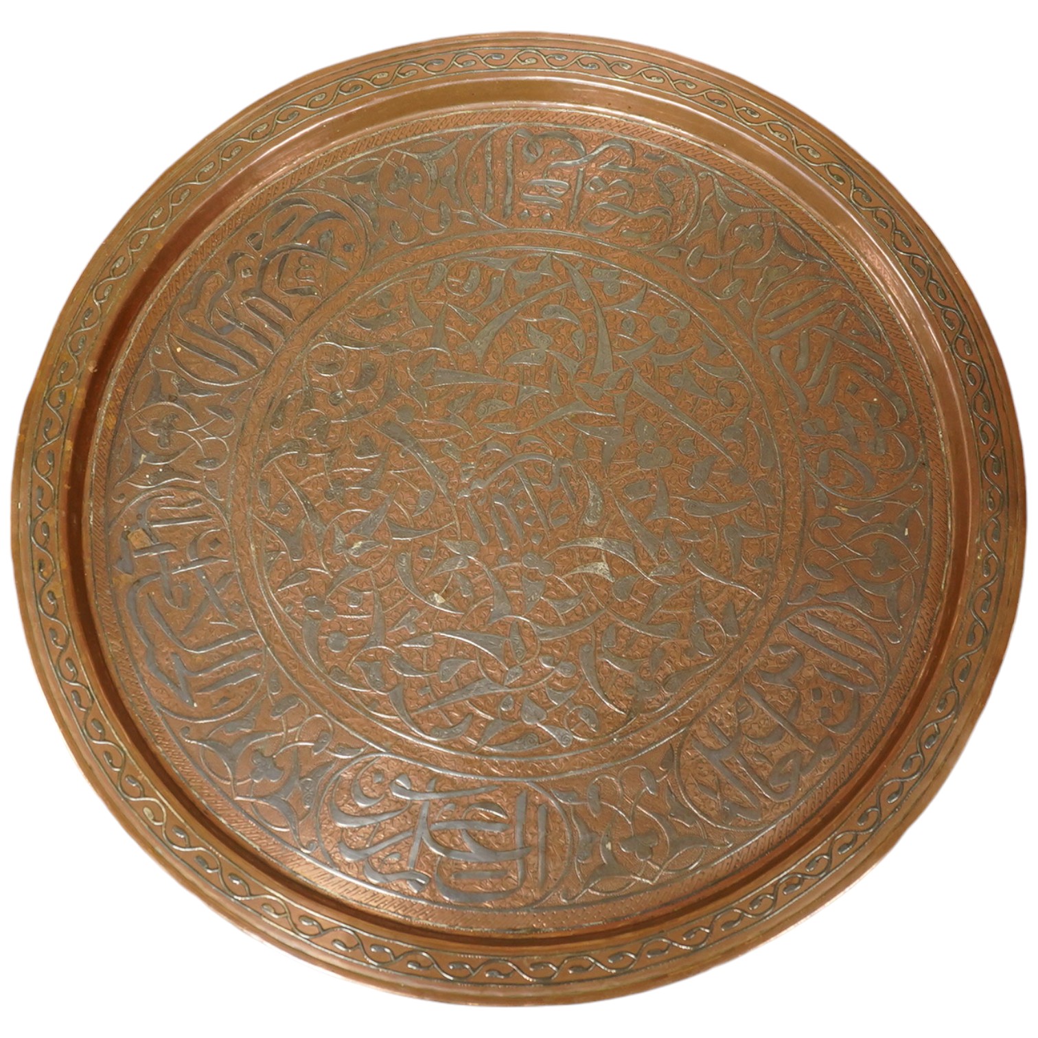 A Middle Eastern circular copper and niello damascened tray, 50cm in diameter. Condition - good